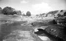 Ruins at Derwent including old bridge, submerged under Ladybower Reservoir, revealed by the drought of 1949