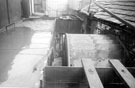 View: y01438 Waterwheel at W.A. Tyzack and Co. Ltd., scythe manufacturers, Clay Wheel Forge (also known as Hawksley), River Don at Wadsley. Photograph taken when Tyzack's were giving up the tenancy, and Messrs. Dunford and Elliott were intending to demolish work