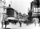 High Street from 'Coles Corner', Nos. 10 - 14 William Foster and Son, tailors, right, premises on left include No. 7 London City and Midland Bank, Nos. 9 - 11 Sheffield Goldsmiths' Co., silversmiths and Castle Chambers, left (note water cart, left) High Street from 'Coles Corner', Nos. 10 - 14 William Foster and Son, tailors, right, premises on left include No. 7 London City and Midland Bank, Nos. 9 - 11 Sheffield Goldsmiths' Co., silversmiths and Castle Chambers, left (note water cart, left)