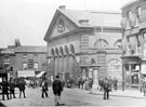 Norfolk Market Hall, Haymarket, prior to the rebuilding of the west front 1904-5. Exchange Street in background, including No. 3, Maypole Dairy Co.