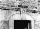 No 25, Market Square, Woodhouse, showing  carved lintel over front doorway, dated 1656. The yard was known as Hardcastle's Yard. Owner at time of photograph was Mrs E. Hardcastle.