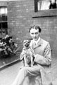 Unidentified man and pet dog Unidentified man and pet dog