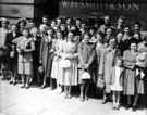 Employees of W. H. Smith and Son Ltd. outside Sheffield Wholesale House, Exchange Street before setting off on their outing to Chatsworth House, 1952/53