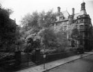 View: y02555 Entrance from Norfolk Street to St. Pauls churchyard with the Town Hall in the background, Cheney Row is between the end of the churchyard and the Town Hall