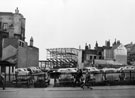 High Street looking towards the Odeon Cinema under construction with the gable end of No. 21 Blake's Medical Store Ltd. right and rear of properties Fitzalan Square (left)