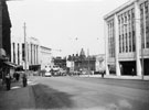 High Street looking towards Blitz damaged Montague Burton Ltd., tailors, showing newly constructed John Walsh Ltd (right)