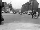View: y02642 Snig Hill from the junction of Castle Street looking towards a sign for the Black Swan Hotel (left) and Corporation Buildings (right)