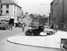 View: y02644 Norfolk Street looking towards Fitzalan Square showing No.18 Thornton Chocolate Kabin  at the junction with Change Alley (left) and the Odeon Cinema (right)