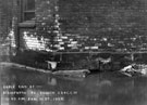Flood at 2.45 p.m. the gable end of Nos. 20-50, Staniforth Road Branch, Brightside and Carbrook Co-operative Society Ltd.