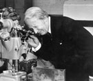 Prime Minister The Rt. Hon. Edward Heath M.B.E., M.P. looking through an instrument for inspecting saws during a visit to Aven Tools, Maltby, Rotherham (subsidiary of Firth Brown Tools Ltd.?)