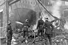 Still smouldering at 10.00am the morning after the fire at Mellowes and Co. Ltd., metal window manufacturer, Bridge Street 