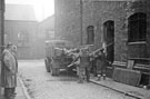 Salvage operations by the maintanance staff after the fire at Mellowes and Co. Ltd., metal window manufacturer, Bridge Street 