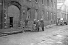 Salvage operations by the maintanance staff after the fire at Mellowes and Co. Ltd., metal window manufacturer, Bridge Street 
