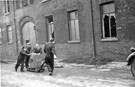 Salvage operations by the maintanance staff after the fire at Mellowes and Co. Ltd., metal window manufacturer, Bridge Street 