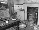 Interior of No. 75 Carwood Road showing the back room and original Firegrate 