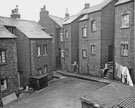 View: s27814 Nos. 13-9, Thorndon Road; yard entrance; three back doors in one small area, Nos. 3, Thorndon Street; 120 (steps leading to) and 122-130, Sutherland Road 