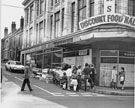 Barrow boy outside John Banner Ltd.,  junction of Shortridge Street and Attercliffe Road