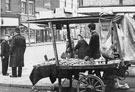 Barrow boy standing at the junction of Bodmin Street and Attercliffe Road No. 709 Kings Head public house in the background Barrow boy standing at the junction of Bodmin Street and Attercliffe Road No. 709 Kings Head public house in the background