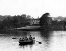 Rowing, Crookes Valley Park boating lake with Dam House in the background Rowing, Crookes Valley Park boating lake with Dam House in the background