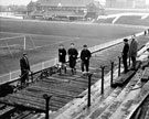 Players still training during the construction of the Stand, Sheffield United FC., Bramall Lane Football Ground  with the Cricket Pavilion in the background