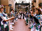 View: s29029 Female Morris dancers performing in Orchard Square during Environment Week