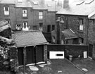Rear of Nos. 25 (door of); 27-29 Thorndon Road from the yard of Nos. 9-19 looking towards rear of housing on Harleston Street