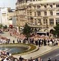 View: t05516 Visit of Queen Elizabeth II and Prince Philip to Sheffield, 29th July 1975. Crowds line Fargate near the Goodwin Fountain.