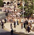 View: t05517 Visit of Queen Elizabeth II and Prince Philip to Sheffield, 29th July 1975. Crowds line Fargate at the top of Surrey Street, and outside the Town Hall.