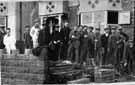 Worrall. Workers outside houses under construction on Haggstones Road.