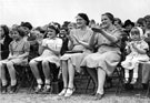 The 'Holidays at Home' scheme, World War  2. Crowds watching entertainment in a local park.