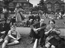 The 'Holidays at Home' scheme, World War 2.  Watching a toy yachting display at Millhouses Park