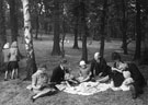 The 'Holidays at Home' scheme, World War 2.  Group having a picnic in a local park.