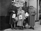 Sheffield and Ecclesall Co-operative Society Ltd, group of women standing outside an unknown store with their free grocery parcels
