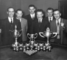 Group of men connected with the Sheffield and Ecclesall Co-operative Society Ltd with unidentified trophies