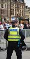 A policemen faces protesters against an English Defence League (EDL) visit to Sheffield