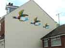 Mural of 'Ducks in Flight' on the gable end of a house on Albert Road, Heeley. 