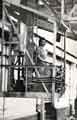Doris Coyne (nee Speight) at her gantry crane operating station during World War Two, Samuel Fox and Company Limited, Stocksbridge, c. 1944/5