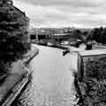 View of the Sheffield and South Yorkshire Navigation Canal with Victoria Station Viaduct and Royal Victoria Holiday Inn in the background 