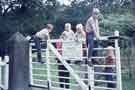 Children, including members of the Teasdale family, at the gate just beyond the old chapel at Longshaw Estate