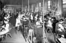 Silversmiths at work - in this one shop alone over 50 silversmiths are employed - R. F. Mosley / The Alexander Clark Manufacturing Co., Welbeck Works
