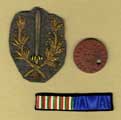 Badges and identity disc of Captain A. J. Ellison, 1st Battalion, York and Lancaster Regiment