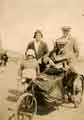 Arthur, Annie and Nancy Fisher with friend Jack Hind, on holiday at Blackpool. Arthur Fisher in a three wheeled wheelchair.