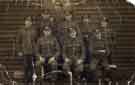 York and Lancaster Regiment First World War soldiers (possibly all from the Hallamshire Battalion) outside an army hut in an unknown location