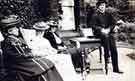 Group of three ladies and James Dixon (1851 - 1947) sitting outside Lady Bower House