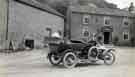 Wightman family members in motorcars outside what appears to be the Ladybower Inn, Derbyshire
