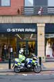 Police motorcyclist outside G-Star Raw Fashion retailer, 112 Devonshire Street