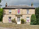 House (next door to the Hare and Hounds Public House) decorated with Union Jacks in Church Street, Oughtibridge