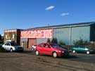 Cars and old industrail units on Penistone Road Sheffield