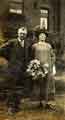 Mr [John Richard] and Mrs [Ruth] Dearn at the wedding of Evelyne Crofts and G [George Watson] Dearn, possibly at St. Cuthbert's C. of E. Church, Barnsley Road 