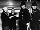View: s02948 Watch Committee, Lord Mayor, Harry England Bridgwater hands a certificate of merit to a Constable in the Lord Mayor's Parlour, Town Hall